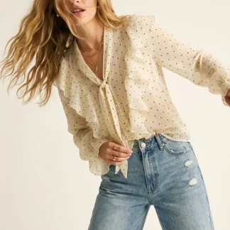 Blusa de bolinhas com folho à frente e punhos com folhos